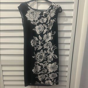 Flower print Black and White Floral Dress. Will fall around the knee.